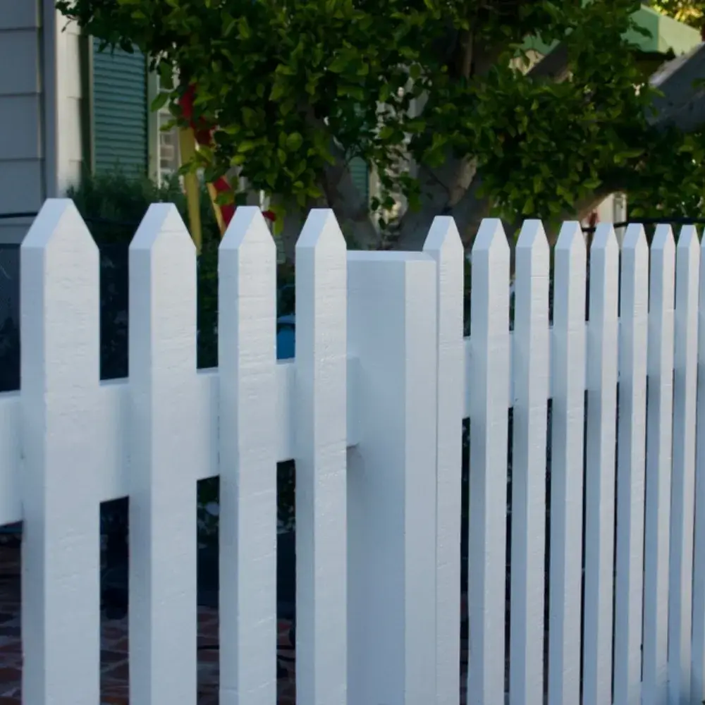 White picket fence with a clean and freshly painted finish