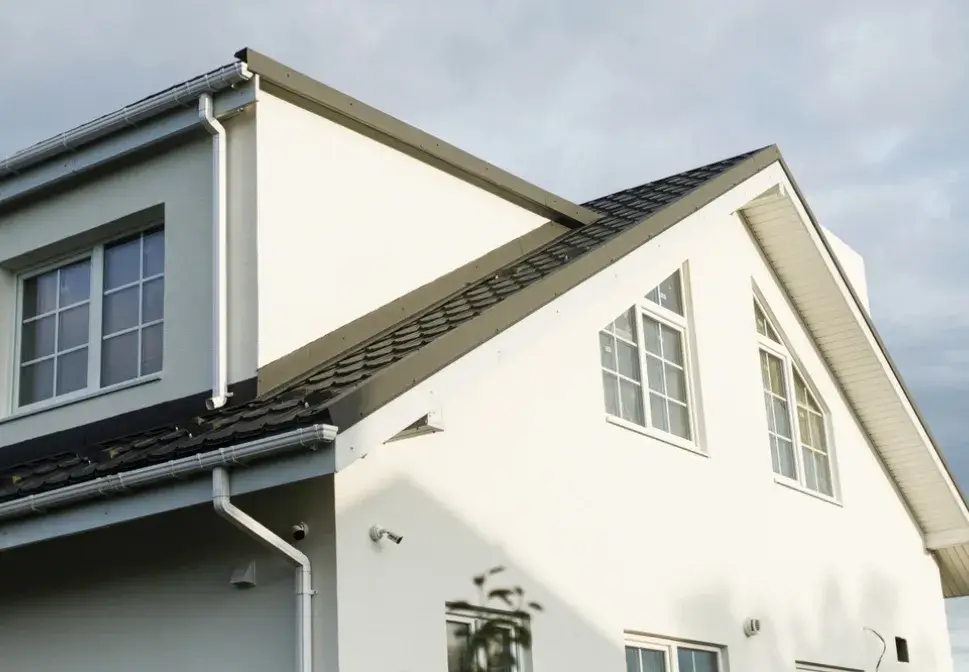 Freshly painted exterior of modern white two-story home with clean lines